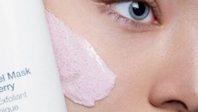 Lip Treatments - Close-up of a woman applying skincare mask with product visible, showcasing beauty routine.