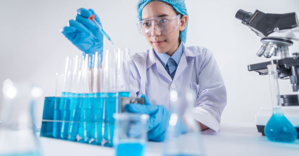 Safety Goggles - A female scientist using lab equipment for research in a modern laboratory setting.