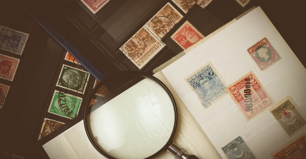 Stamps - Explore a detailed view of vintage postage stamps through a magnifying glass, highlighting intricate designs.