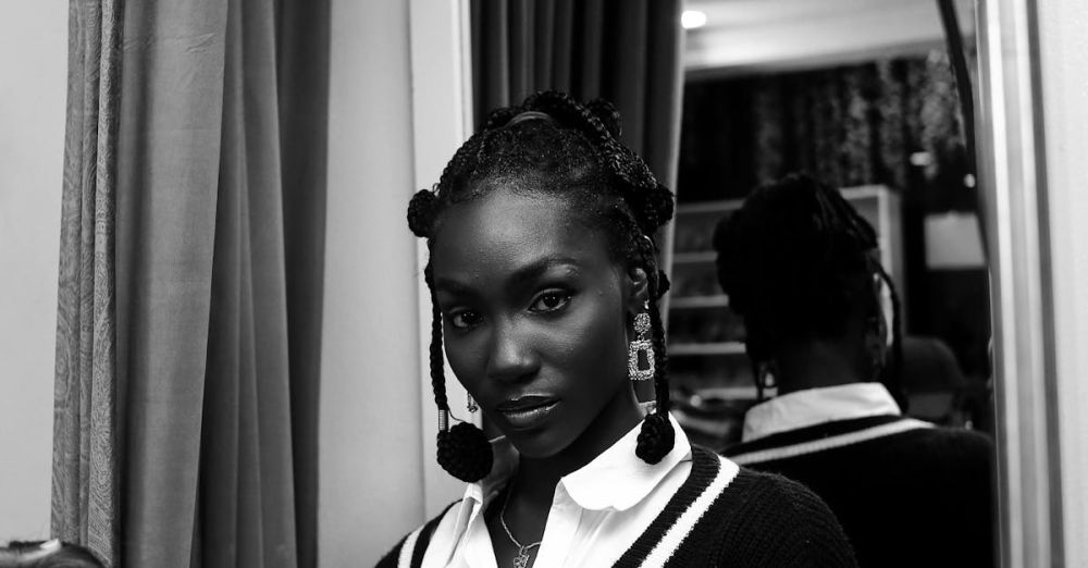 Retro Jewelry - Captivating black and white portrait of an elegant woman in a stylish outfit indoors.