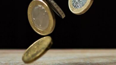 Coins - Dynamic shot of euro coins appearing to float, symbolizing active economy.