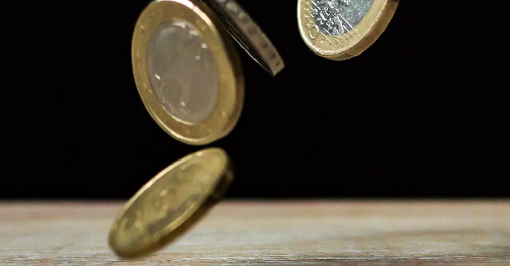 Coins - Dynamic shot of euro coins appearing to float, symbolizing active economy.