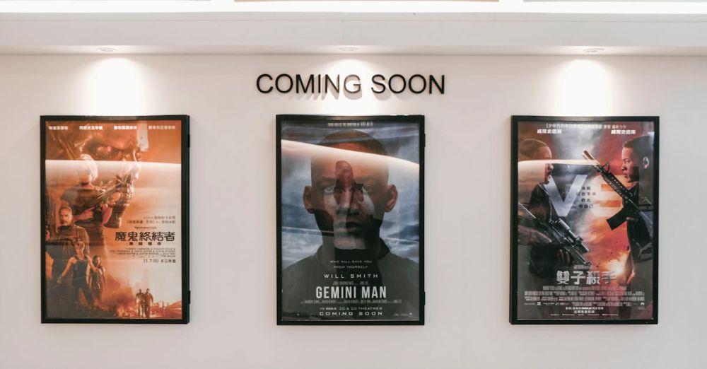 Movie Posters - Framed posters of upcoming movies in a cinema hallway under 'Coming Soon' sign.