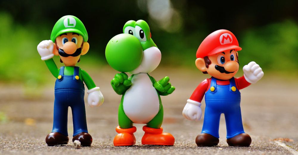 Action Figures - Vibrant Super Mario, Luigi, and Yoshi figures arranged outdoors on a sunny day.