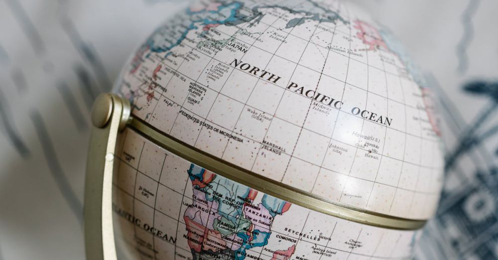 Antique Maps - Classic vintage globe captured on a detailed patterned fabric, showcasing world geography with a timeless appeal.