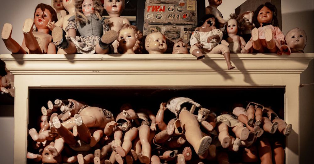 Antique Dolls - A spooky assortment of vintage dolls on a shelf, creating an eerie atmosphere.