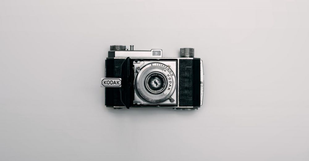 Retro Electronics - A classic Kodak camera displayed centrally on a minimalist white background.