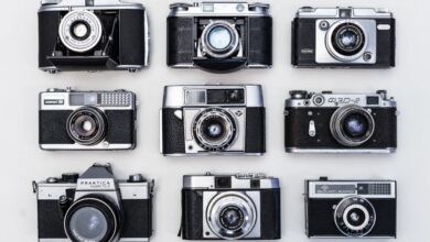 Cameras - A flat lay of various vintage cameras showcasing classic photographic equipment.