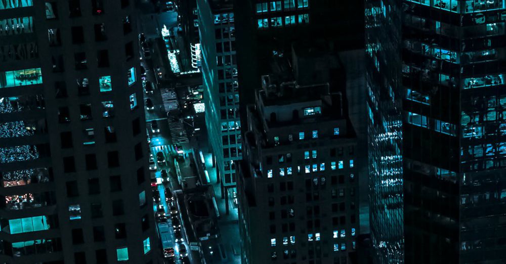 Night - Captivating aerial view of illuminated skyscrapers in New York City during the night.