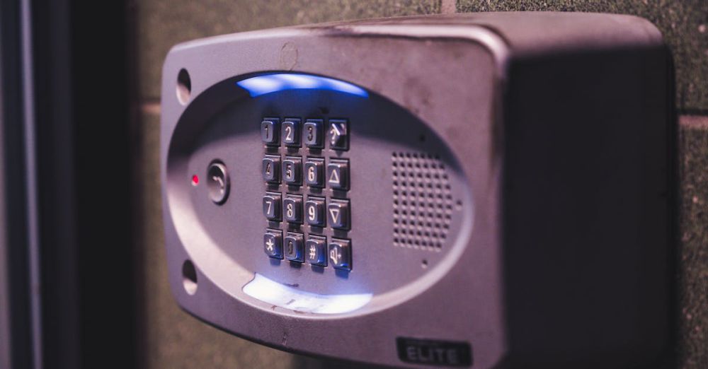 Doorbell - A close-up image of an illuminated security keypad mounted on a wall.