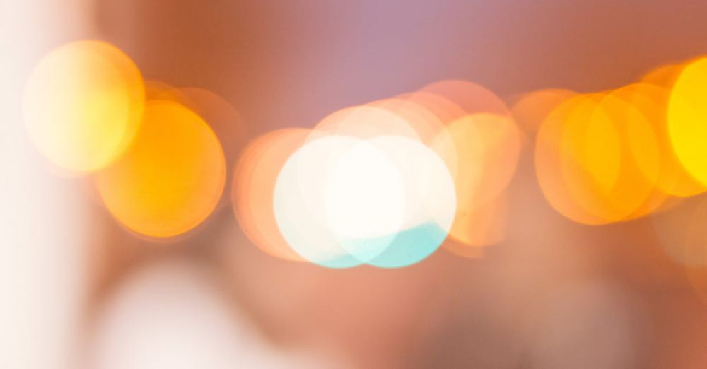 Warm - A soft-focus abstract image with warm bokeh lights creating a dreamy effect.