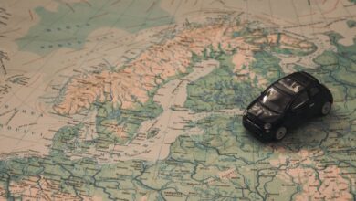 Navigation - A miniature black car on a detailed map of Scandinavia, symbolizing travel adventures.