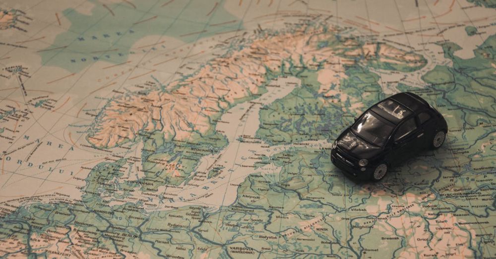 Navigation - A miniature black car on a detailed map of Scandinavia, symbolizing travel adventures.