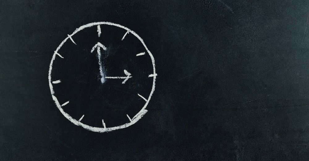 Time - Chalk-drawn clock on a blackboard, symbolizing time and education concepts.