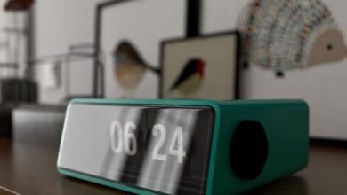 Alarms - A sleek digital clock displaying 06:24 on a stylish wooden surface indoors.