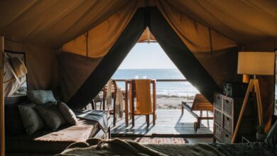 Luxury Camping - A luxurious tent setup with a view of the ocean, perfect for a peaceful getaway.