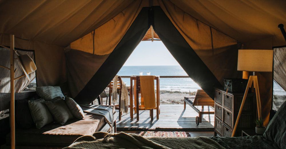 Luxury Camping - A luxurious tent setup with a view of the ocean, perfect for a peaceful getaway.