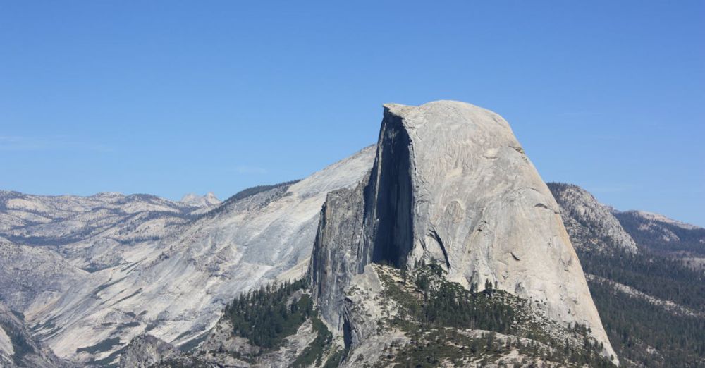 National Parks - Breathtaking summer view of Half Dome's majestic granite peak in Yosemite National Park.