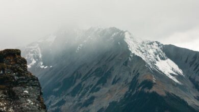 Remote Parks - Captured in Field, BC, a majestic mountain partly shrouded in mist creates a dramatic scene.