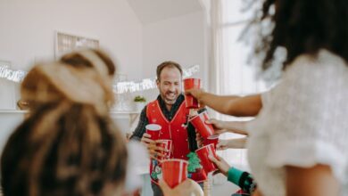 Food Festivals - A joyful holiday party with friends toasting indoors, enjoying laughter and cheer.