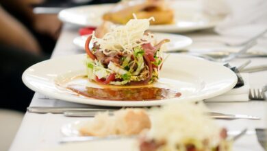 Fine Dining - Long dining table set with gourmet salads, perfect for a fine dining experience.