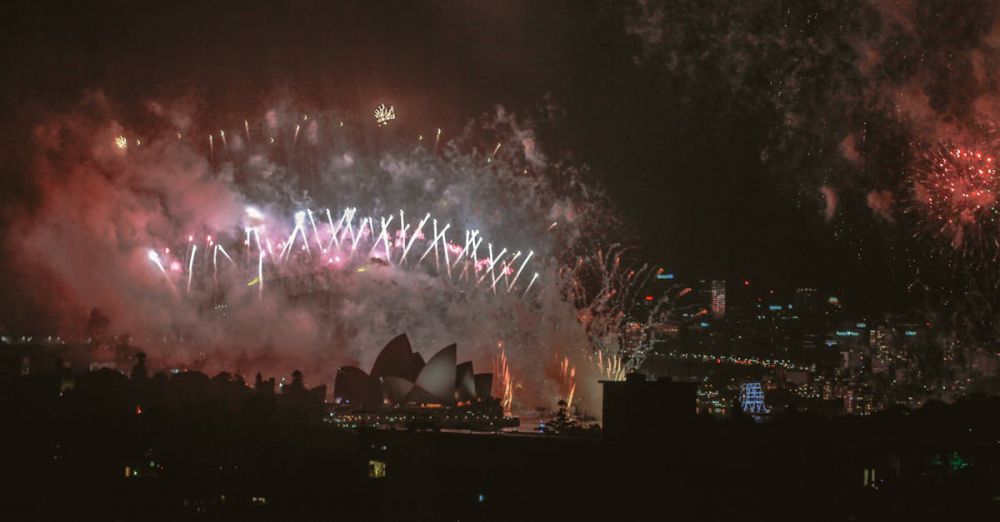 Iconic Festivals - Fireworks display lighting up the night sky over Sydney Opera House.