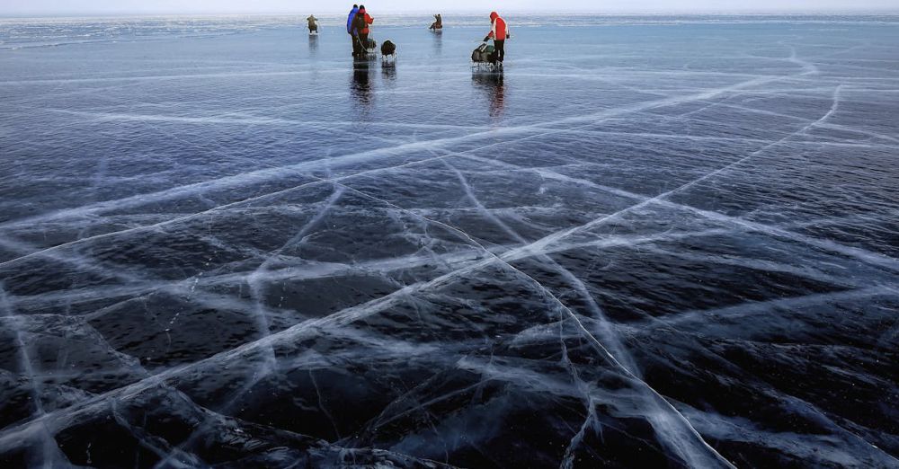 Ice Fishing - Explore a winter wonderland on the frozen surface of Lake Baikal, Russia.