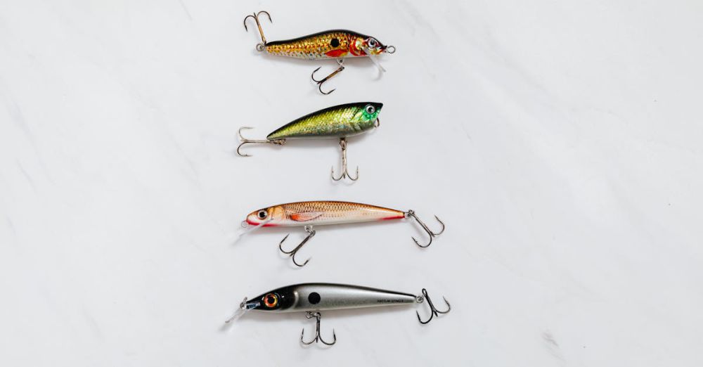 Pike Fishing - Variety of fishing lures arranged on a white surface for equipment showcase.