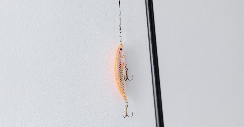 Tackle Shops - Detailed close-up of a fishing lure attached to a fishing rod, perfect for angling or fishing enthusiasts.