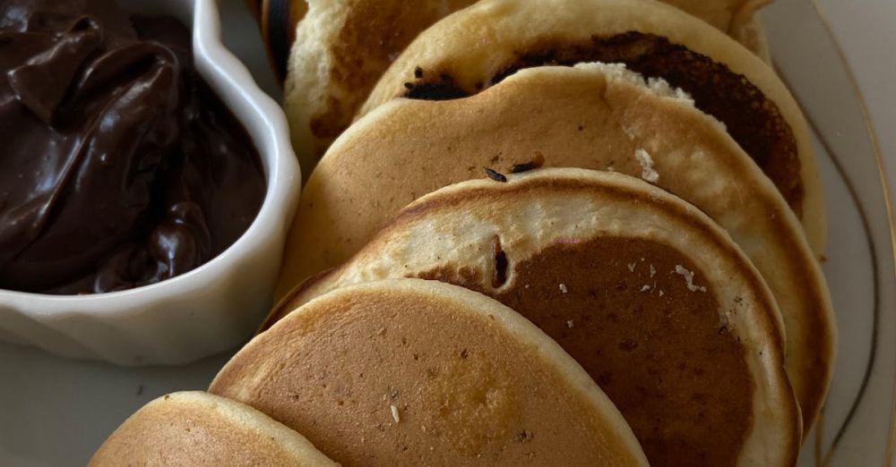 Maple Syrup Tasting - Mouth-watering pancakes spread with rich chocolate, perfect for a hearty breakfast.