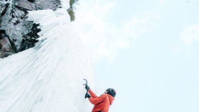 Quebec Experiences - Thrilling ice climbing adventure on frozen walls in Quebec during winter.