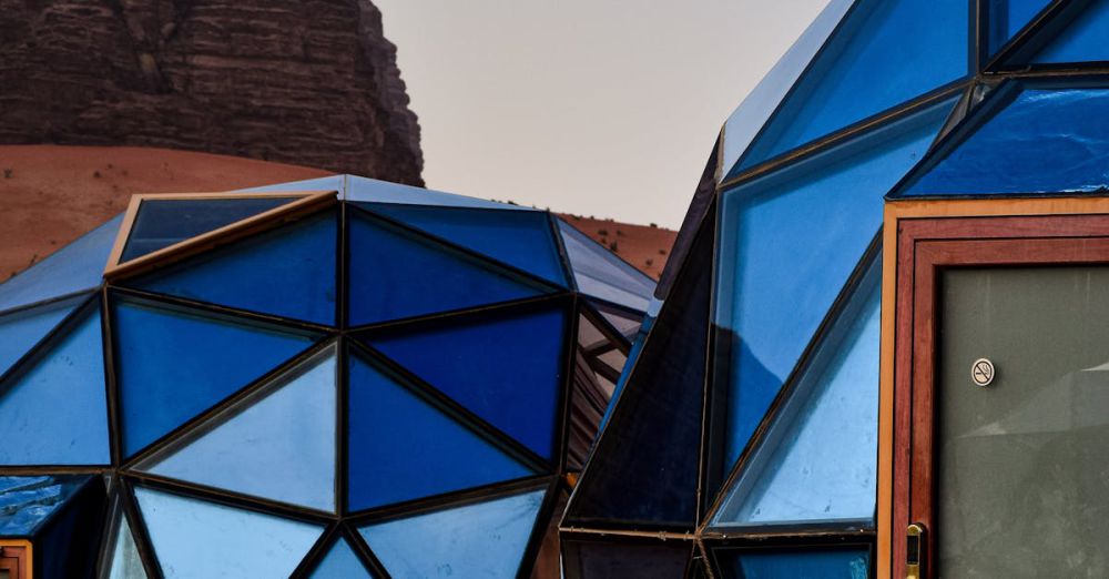 Unique Experiences - Modern geodesic domes in the Wadi Rum desert, showcasing innovative architecture and stunning natural scenery.