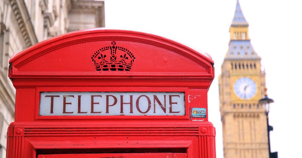 Historical Sites - Classic red telephone booth with Big Ben in the background, symbolizing London.