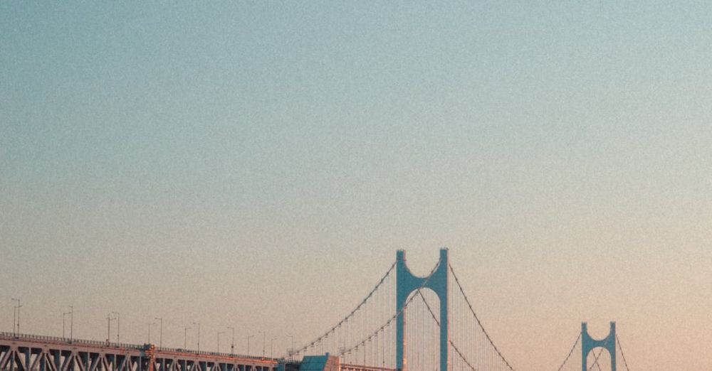 Scenic Sites - Scenic view of Gwangan Bridge in Busan, South Korea, during sunset over a calm sea.