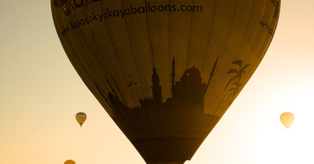 Popular Springs - Hot air balloons in Cappadocia, Turkey during sunrise with a scenic backdrop.