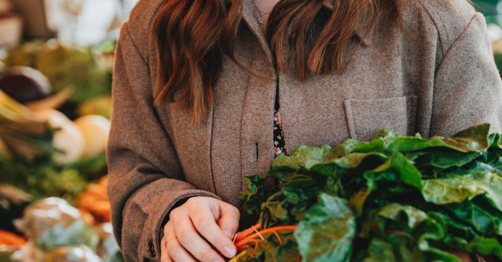 Choosing Springs - Smiling woman selects fresh vegetables at Erfurt's bustling outdoor market.