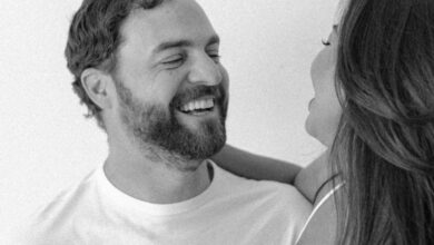 Couples Spas - A joyful couple captured in a black and white studio portrait, highlighting love and connection.