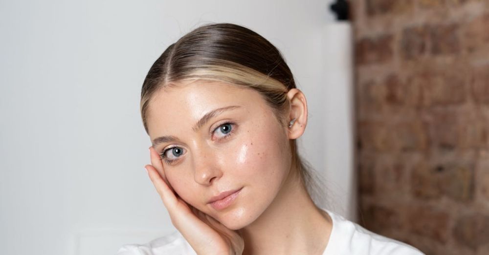 Skincare Spas - Portrait of a young woman with a thoughtful pose in a minimalist setting.