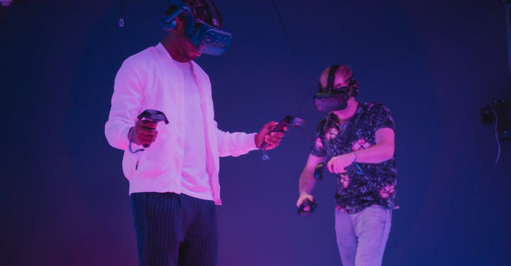 Advanced Players - Two men wearing VR headsets and controllers immersed in a virtual reality gaming environment.