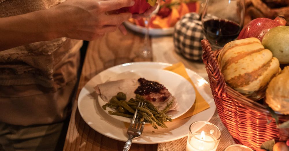 Family Courses - A warm Thanksgiving dinner setup with candles, food, and festive decor.