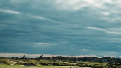 Golf Tips - Golfer playing on scenic golf course, Kiawah Island, SC, with dramatic cloudy sky.