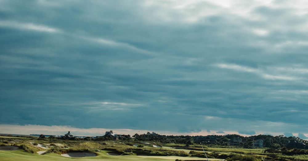 Golf Tips - Golfer playing on scenic golf course, Kiawah Island, SC, with dramatic cloudy sky.