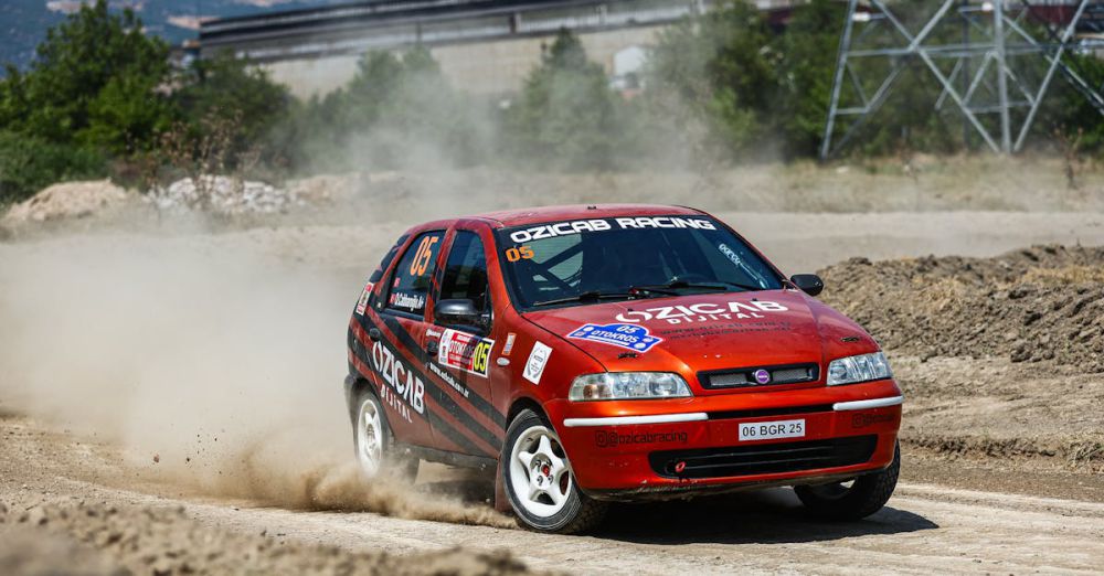 Challenging Courses - A Fiat Palio fiercely competes in a dusty rallycross event, capturing the thrill of motorsport.