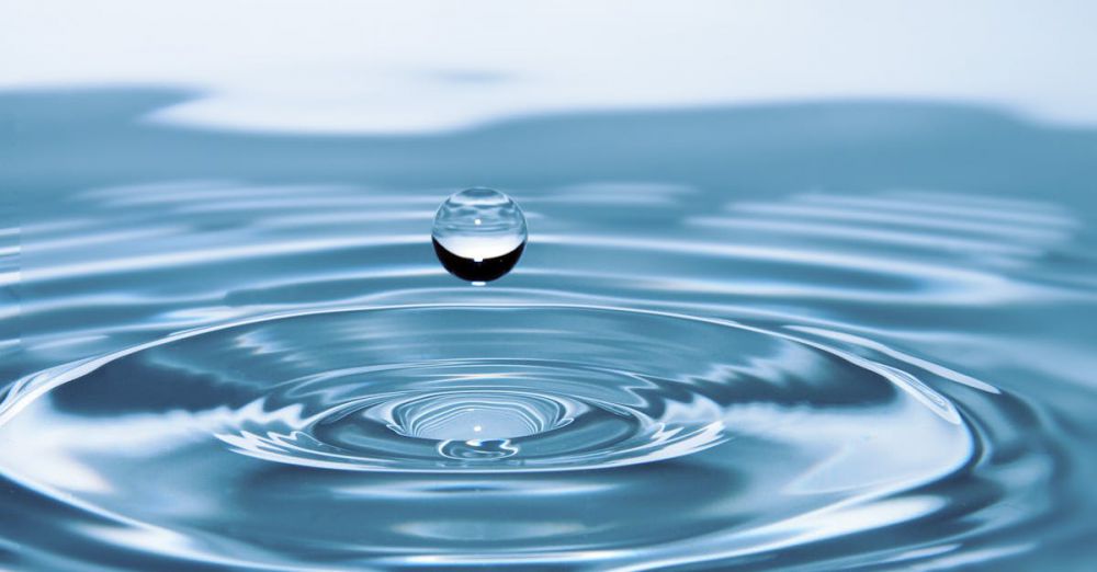 Water Filter - A mesmerizing shot of a water droplet capturing the beauty of liquid dynamics.