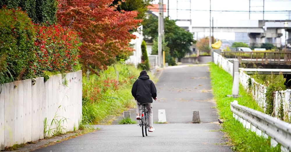 Fall Cycling - Bicycle Boy in a village