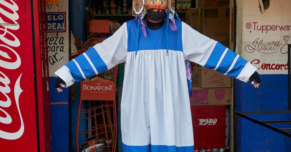 Indigenous Culture - Person in colorful traditional costume at Tepoztlán carnival, Morelos, Mexico.