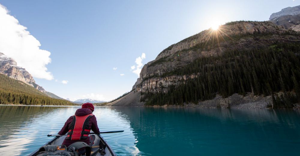 Solo Kayaking - A serene kayaking journey on a crystal lake in Banff National Park, Canada.