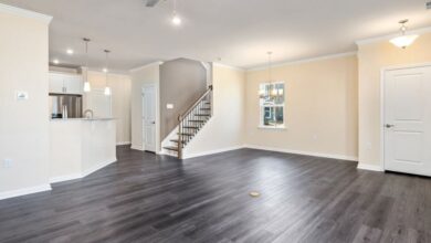 Refurbished Appliances - Empty modern living space with hardwood flooring and ceiling fan, ideal for new home or renovation concepts.