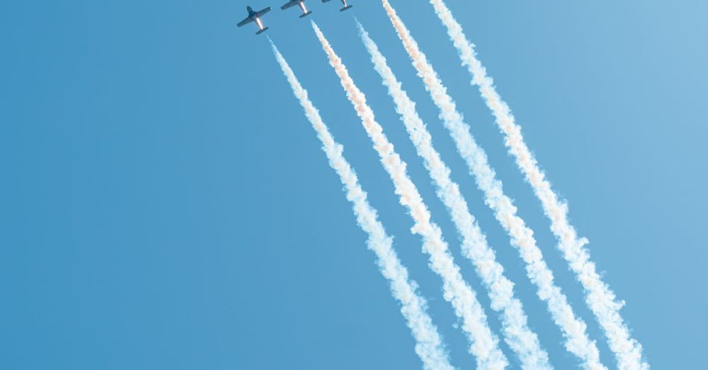 Ontario Trails - Jet planes performing an aerial display with smoke trails against a clear blue sky in Toronto.