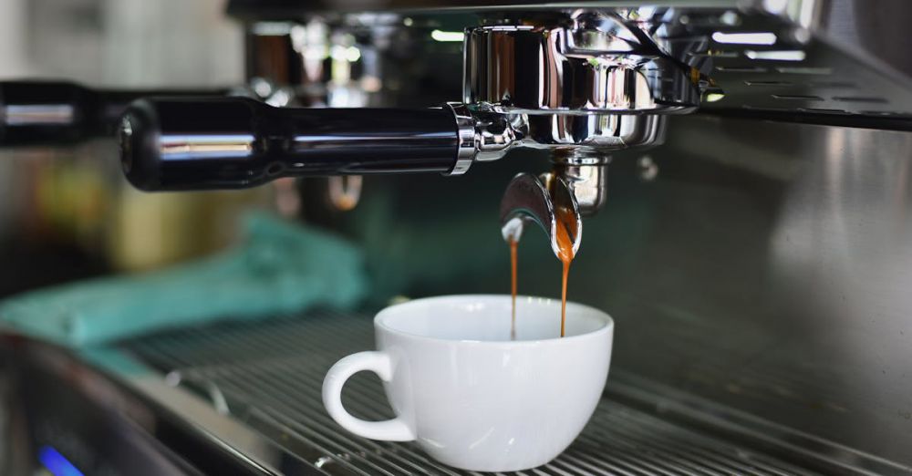 Coffee Machine - Close-up of espresso pouring from a shiny coffee machine into a white cup, perfect for lovers of caffeine and barista art.